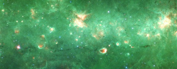 Researchers have identified the first 'bone' of the Milky Way - a long tendril of dust and gas that appears dark in this infrared image from the Spitzer Space Telescope. Running horizontally along this image, the bone is more than 300 light-years long but only 1 or 2 light-years wide. It contains about 100,000 suns' worth of material. Credit: NASA/JPL/SSC