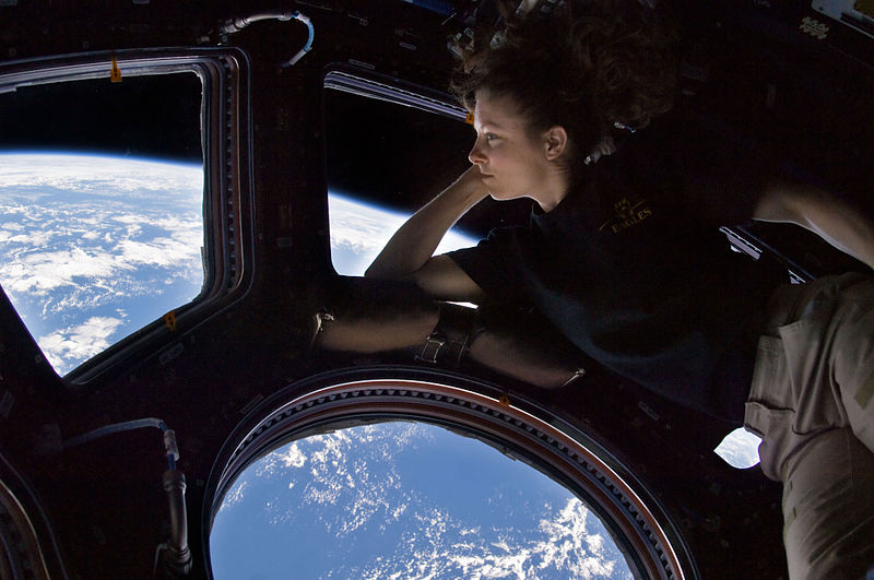 Expedition 24's Tracy Caldwell Dyson gazes out of the cupola. Credit: NASA