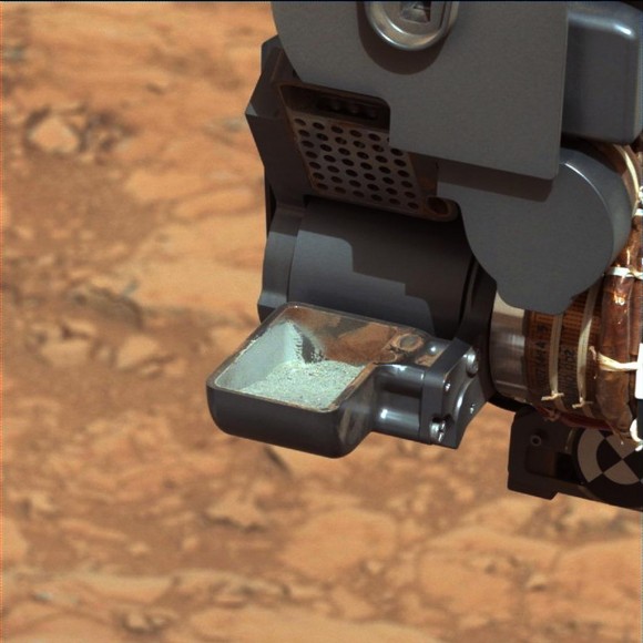 First Curiosity Drilling Sample in the Scoop. This image shows the first sample of powdered rock extracted by the rover's drill after transfer from the drill to the rover's scoop. The sample will now be sieved and portions delivered to the Chemistry and Mineralogy instrument and the Sample Analysis at Mars instrument. The scoop is 1.8 inches (4.5 centimeters) wide. The image was taken by Curiosity's Mastcam 34 camera on Feb. 20, or Sol 193.The image has been white-balanced to show what the sample would look like if it were on Earth. Credit: NASA/JPL-Caltech/MSSS
